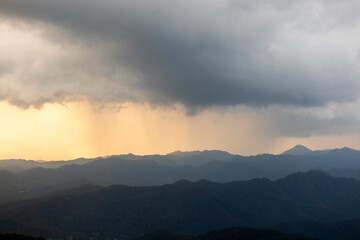 Landscape of Morning Mist with Mountain Layer at north of chiang rai Thailand. mountain ridge and clouds in rural jungle bush forest