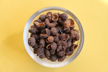 Sichuan pepper or Sichuanese pepper, Szechuan pepper, Chinese prickly ash, Chinese pepper, in a glass bowl