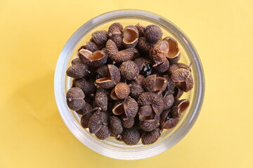 Sichuan pepper or Sichuanese pepper, Szechuan pepper, Chinese prickly ash, Chinese pepper, in a glass bowl