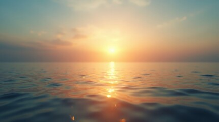 Obraz premium A serene ocean scene with a sunlit horizon, golden sunlight reflecting on calm waters, and a sky transitioning from blue to orange at sunset.