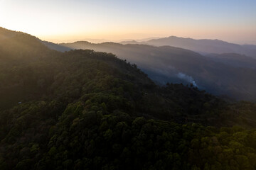 Landscape of Morning Mist with Mountain Layer. mountain ridge and clouds in rural jungle bush forest