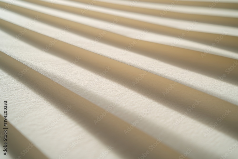 Poster Textured background featuring soft light and shadow patterns in warm beige tones creates an inviting atmosphere for product photography purposes
