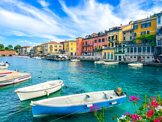 landscape of Peschiera del Garda in the province of Verona in Veneto, Italy. The main canal in a...