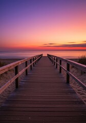 Fototapeta premium Serene sunset over ocean with wooden boardwalk leading to tranquil beach horizon