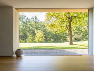 Modern interior with large window overlooking serene landscape during daylight hours