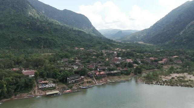 Drone footage along the quiet village of Muang Ngoy in Luang Prabang province, Laos. Surrounded by karst mountains and green vegetation, time seems stopped there...