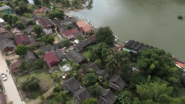 Top down footage above a traditional wooden village along the Nam Ou river (Muang Ngoy, Luang Prabang province, Laos).