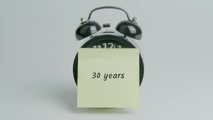 30 Years Text or Word on Yellow Note Paper Sticking onto Black Alarm Clock on White Background With Sound