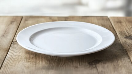 Empty white plate on a wooden table ready for serving fresh fish or seafood dishes in a rustic dining setting