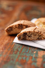 Cantuccini (Italian cookies) on dark wooden background. Close up