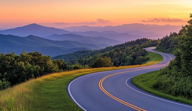 Scenic mountain road curving through lush green landscape at sunset.