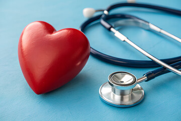 Red heart and stethoscope on blue background, Heart Health concept