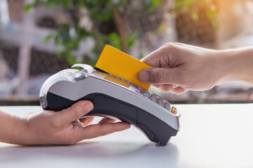 Paying for services by credit card on EDC machine or credit card terminal.