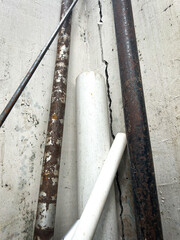 pile of iron pipes, cast iron and plastic pipes