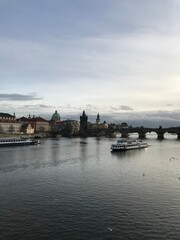 boats on the river near the bridge in old town