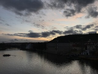 Obraz premium sunset over the river in old town, city