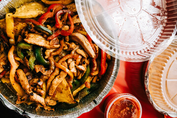 Chicken Fajitas Mexican Food Takeout on Red Table