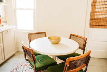 White Table With Four Chairs in a Boho Dining Room