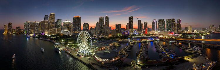 American urban landscape at night. Miami marina and Skyviews Observation Wheel at Bayside...