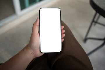 Smart phone mockup. Women hands holding cell telephone blank copy space screen smartphone blank white screen isolated technology concept.