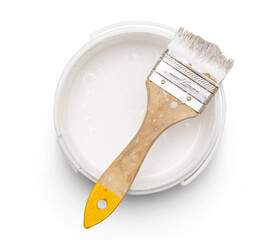 Can of white paint with brush