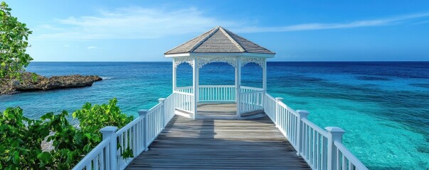 Fototapeta premium Serene gazebo by the ocean overlooking turquoise waters and clear blue sky