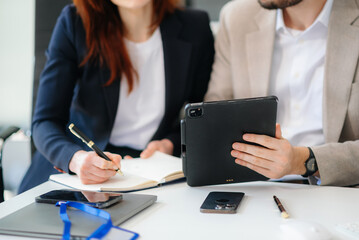 Businessman and team analyzing financial statement Finance task. with smart phone and laptop