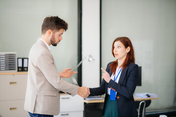 business people shaking hands during a meeting in office.