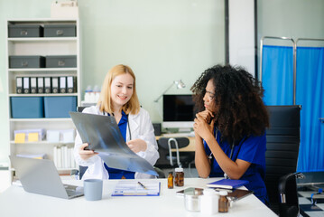 Medical, meeting and doctors with laptop for research, planning and hospital schedule management.