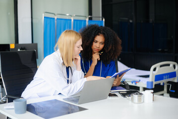 Medical, meeting and doctors with laptop for research, planning and hospital schedule management.