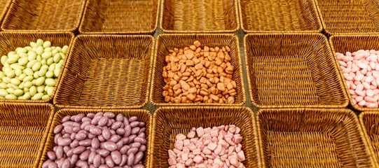A basket of nuts with a variety of colors and shapes