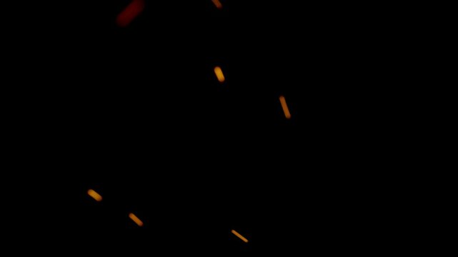 Dramatic close-up of intense flames with glowing ember particles on a black background, ideal for cinematic, fire, or abstract projects
