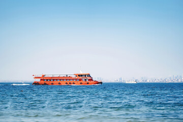 Fototapeta premium orange ship for transporting people in istanbul. metal ship with passengers in the bosphorus