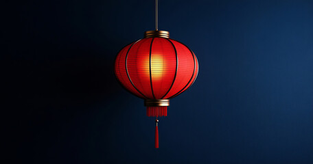 Obraz premium A single red lantern hangs against a dark background, its simplicity symbolizing the Chinese New Year. The warm glow and minimalist design create an atmosphere of quiet elegance.