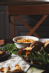 rustic cottage kitchen with wild edible mushrooms (chanterelles) ready for cooking