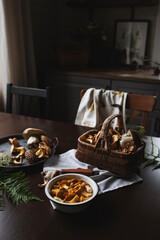 wild edible mushrooms picked from forest. Preparing for cooking in rustic cottage kitchen