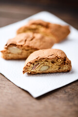 Cantuccini (Italian cookies) on dark wooden background. Close up