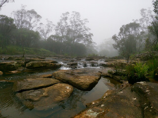 Foggy cascading river 