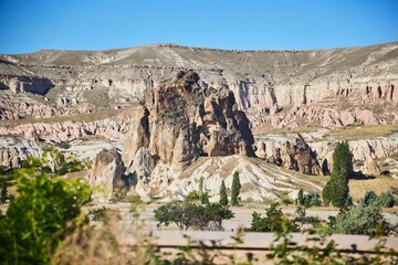 Fototapeta premium Goreme National Park, Turkey. Traditional tuff mountains in Cappadocia. Cave city, ancient buildings