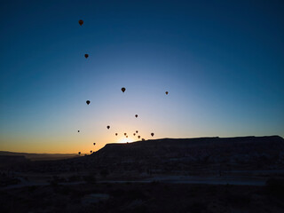 Balloons lifted into the air in Cappadocia. Entertainment and tourist attraction. A spectacular sight