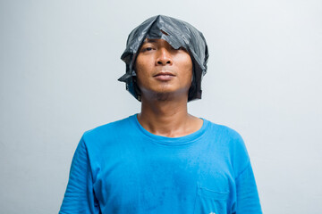Man covers his head with a plastic bag