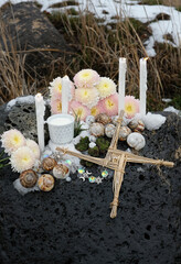 Wiccan altar for Imbolc holiday. Brigid's cross of straw, candles, flowers, milk and snail shells...