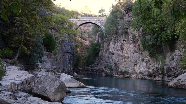 Oluk Bridge. Bridge Canyon ( Koprulu Kanyon ) national park. Historical Roman bridge over the Koprucay river. One of the touristic landmarks of Antalya. Travel to Turkey country - 4k video 
