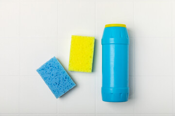 Colorful dish sponges on textured background. Kitchen sponge. Cleaning concept, cleaning service. Dishwashing liquid with clean and dirty dishes plate. Place for text, copy space. Wash the dishes.