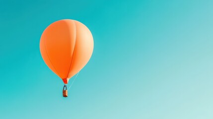 Obraz premium Vibrant Orange Hot Air Balloon Floating in Clear Blue Sky, Perfect for Advertising or Decorative Backgrounds