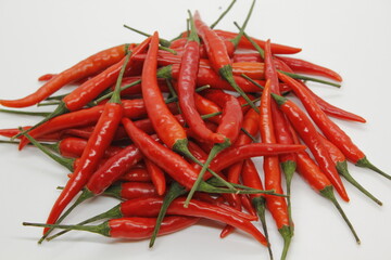 A group of red hot chili peppers and green hot chili peppers are ripe for bring to be a ingredient.