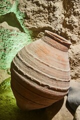 Fototapeta premium An ancient amphora or jug made of clay. Ancient crafts