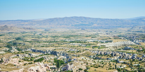 Uchhisar city from a height in Cappadocia, Central Anatolia region, Turkey. Tuff mountains.