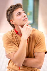 Young Man Thinking and Looking to the Side.Vertical