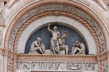 The Porta Magna with sculpture by Jacopo della Quercia. San Petronio Basilica.  Bologna, Italy